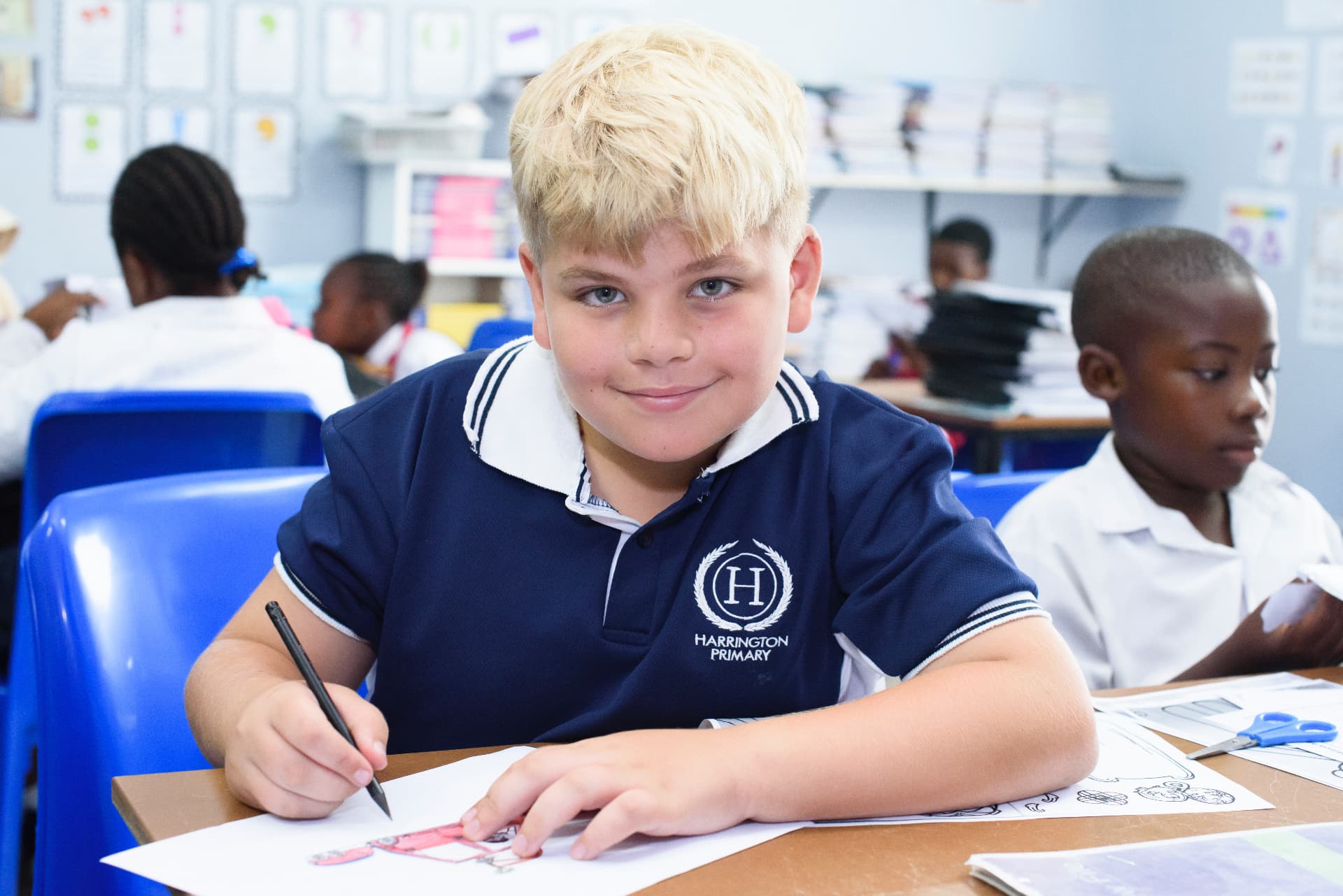 A Harrington pupil illustrating a design in class